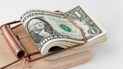 13510403 - many american dollar bills in mouse trap  debt trap